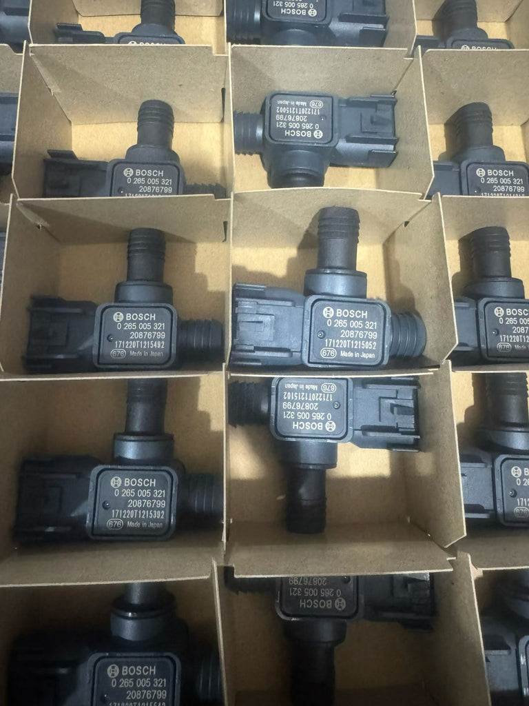 0265005321 and 20876799 markings on new brake booster pressure sensors in industrial packaging