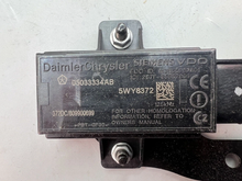 Load image into Gallery viewer, Reference image — aftermarket front TPMS trigger module 05033334AB — exact reference marking and mounting hardware close-up; external native reference only, not actual stock