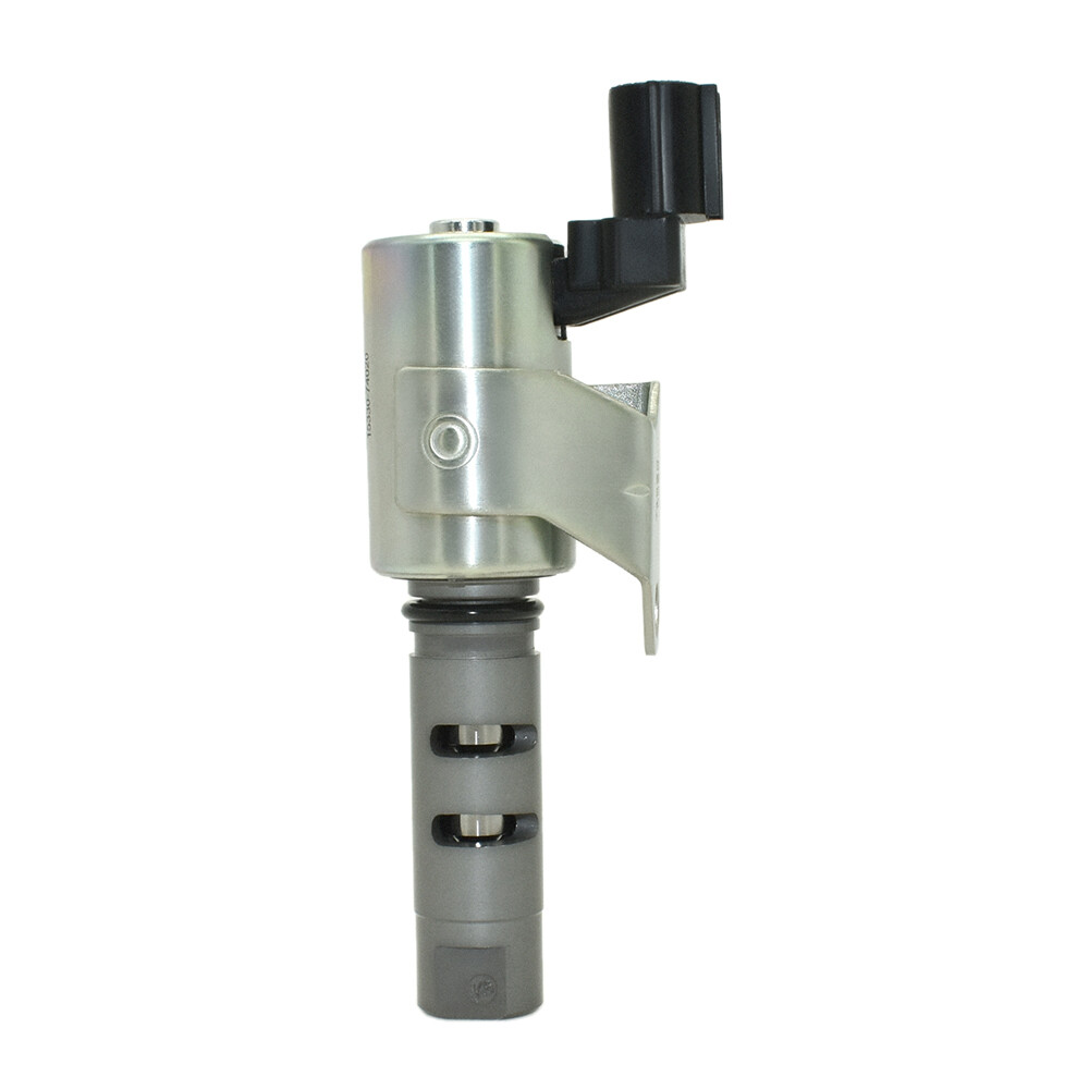 Predecessor-reference image — original 15330-74020, catalogued replacement 15330-74021; not actual-stock imagery: complete valve side with mounting bracket and oil ports