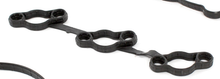 Load image into Gallery viewer, Reference photograph - 22441-3CGA1 right rocker-cover gasket set - same-photo linked inner seal detail, six circular openings and three shaped passages