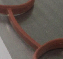Load image into Gallery viewer, Reference photograph - intake manifold gasket 28411-2B600 - same-photo curved inter-ring bridge junction detail