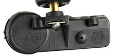 Load image into Gallery viewer, Reference image: Native detail crop of the 315 MHz marking, sensor body and valve junction — 56029479AA