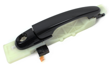 Load image into Gallery viewer, Reference photograph - front-left black exterior door handle with base 82650-2E000 - whole front/oblique handle and attached base
