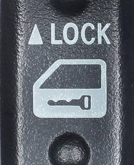 External reference image — lower-native-resolution detail crop of 84930-33080 lock-direction and door-key actuator markings, not another whole-unit angle; supplied aftermarket brand and packaging may differ.