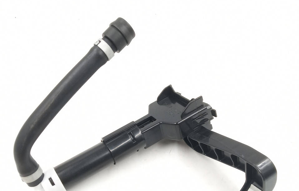 Reference image — right-hand headlamp washer nozzle85207-33030 — opposite partial assembly reference view; lower white end-cap edge and mounting-eye end are outside this crop; external illustration, not actual stock
