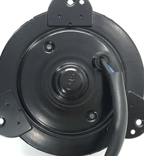 Load image into Gallery viewer, Reference image — cooling fan motor APW950174 — native rear-cover detail with fasteners, lead-entry grommet and portions of mounting ears; edges cropped, not a whole-motor view; external illustration, not actual stock