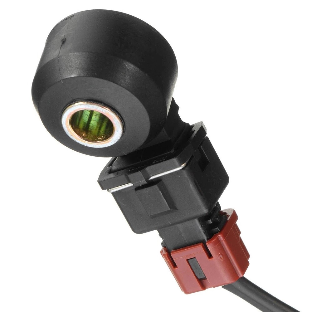 Knock sensor 22060-AA070 - sensor housing and retaining-clip detail; reference photograph, not actual stock